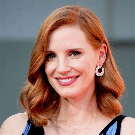 Jessica Chastain lights up the room in bold suit.